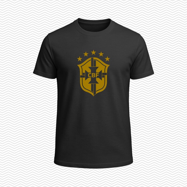 May include: A black short-sleeved t-shirt featuring a gold-colored graphic on the chest. The graphic displays a shield emblem with the letters CBF in the center, topped by five small stars arranged in an arc above the shield design.