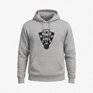May include: A light gray hooded sweatshirt featuring a black graphic on the chest. The graphic displays a shield with a checkered pattern, the letters HNS stacked vertically in the center, and a soccer ball icon positioned at the bottom of the shield.
