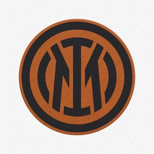 May include: A circular emblem featuring a stylized black monogram of the letters I and M centered within a thick black border on a textured orange background. The design is symmetrical, with the letters intertwined to form a cohesive graphic logo.