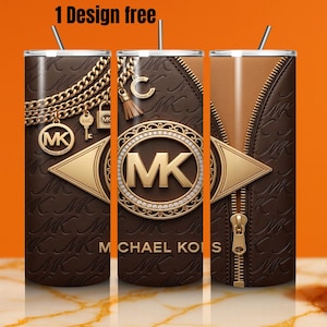 May include: A cylindrical tumbler featuring a brown background with a repeating MK logo pattern. The design includes gold-toned chain graphics, a circular MK emblem with rhinestones, and a central zipper detail. The text 1 Design free is visible.