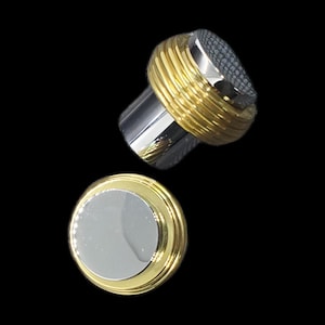 May include: Two-piece set of cufflinks with a gold and silver design. The cufflinks have a silver top with a textured pattern and a gold band. The other cufflink is a silver circle with a gold border.