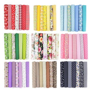 May include: Nine sets of rolled fabric in various patterns and colors. The sets include floral, polka dot, striped, and checkered designs in red, yellow, blue, green, pink, purple, brown, and black.