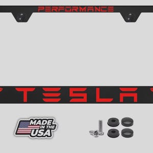 May include: A white ceramic mug with a black handle and the text "But First, Coffee" in a bold, black font. The mug is set against a blurred background, suggesting a cozy setting.