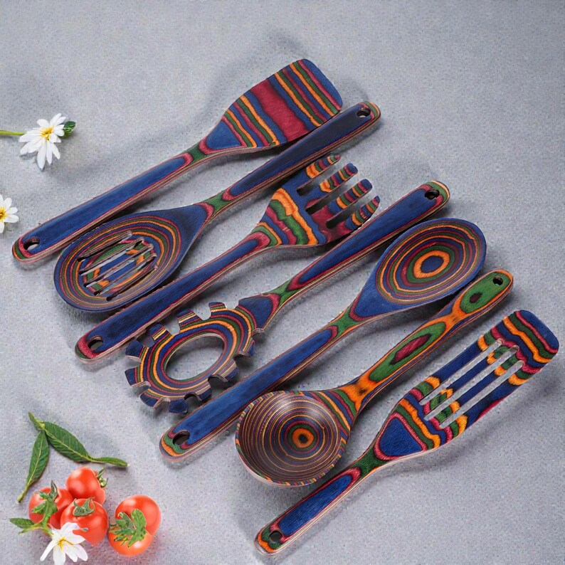 7 piece wooden spoon and spatula set displayed on kitchen counter, crafted from durable Pakkawood with rich natural grain, ideal for modern farmhouse kitchens, eco-friendly home decor lovers, and stylish cooking spaces focused on warmth and functionality.