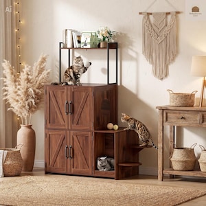 May include: A dark wood cat furniture unit featuring two stacked cabinets with X-pattern doors, black metal handles, an open top shelf, and a side section with two small circular platforms. Two cats are interacting with the unit, and one rests inside.