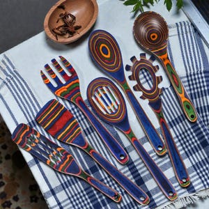 Premium wooden kitchen utensils set designed for nonstick cookware, showcasing smooth Pakkawood finish and ergonomic shapes, perfect for cozy kitchen decor, boho home styling, and everyday cooking in modern USA homes with natural materials.
