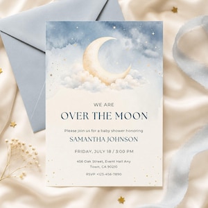 May include: A rectangular baby shower invitation card featuring a watercolor illustration of a crescent moon and clouds against a blue night sky with gold stars. The text reads: WE ARE OVER THE MOON, Please join us for a baby shower honoring SAMANTHA JOHNSON, FRIDAY, JULY 18 / 3:00 PM, 456 Oak Street, Event Hall Any Town, CA 90210, RSVP +123-456-7890.