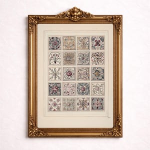 May include: A framed print featuring sixteen square tiles with floral and geometric designs in muted colors. The tiles are arranged in a grid pattern within a cream-colored border. The ornate gold frame adds a vintage aesthetic.