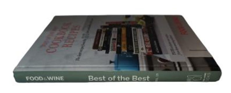 May include: A cookbook titled "Best of the Best" by Food & Wine. The book's cover features a stack of cookbooks and the title "The Last Recipe You'll Ever Need". The spine is green with white text.