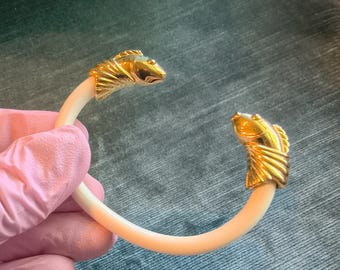 Signed Monet vintage bracelet with a bright gold-tone finish.