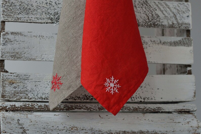 Linen sustainable linen towels in natural and red colors with snowflake design embroidery