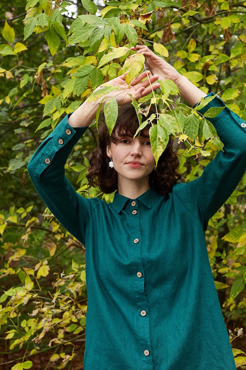 Linen long women's shirt with longer back in emerald green