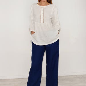 Linen luxurious blouse with handwork in white