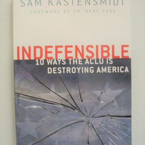 May include: Book cover with the title "INDEFENSIBLE" in red letters. The author's name, Sam Kastensmidt, and the subtitle "10 Ways the ACLU is Destroying America" are also visible. The cover features a shattered glass design over a background with stars.