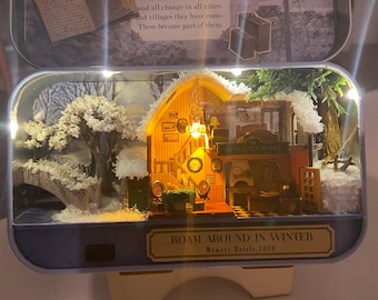 Diorama de lata de menta de paseo por el invierno
