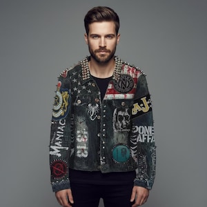 May include: A dark denim jacket with multiple patches and silver studs on the collar. The jacket features patches with text and graphic designs, including a skull and a scorpion. The jacket has a distressed look.