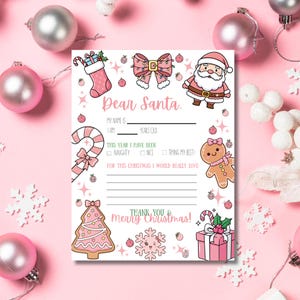 Könnte beinhalten: Ein rosa-weißes "Lieber Weihnachtsmann"-Schreiben mit weihnachtlichen Illustrationen, darunter der Weihnachtsmann, ein Lebkuchenmann und ein Weihnachtsbaum. Der Brief enthält Abschnitte zum Ausfüllen für Name, Alter und Weihnachtswünsche.