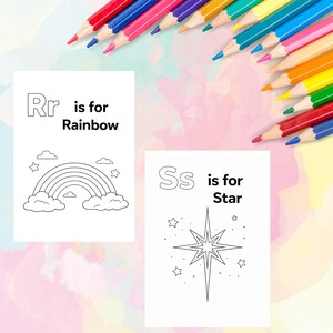 May include: Two white cards with black line drawings and text. One card says "Rr is for Rainbow" with a rainbow graphic. The other card says "Ss is for Star" with a star graphic. Colored pencils are in the background.