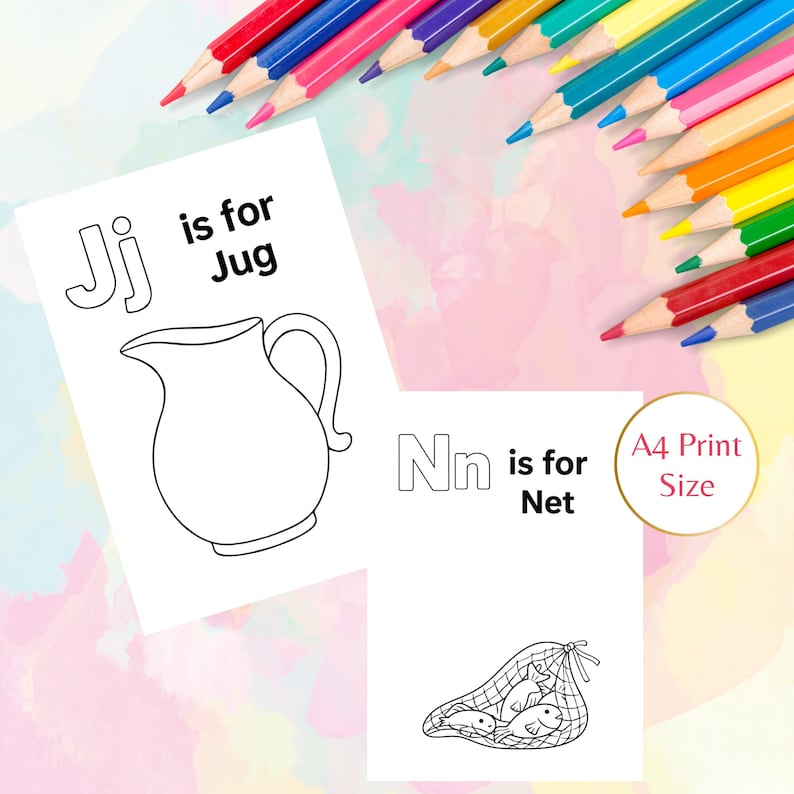 May include: Two white paper sheets with black line drawings and text. One sheet says "Jj is for Jug" with a jug illustration. The other says "Nn is for Net" with a net illustration. Colored pencils are in the background.