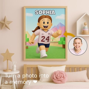 May include: Framed artwork featuring a cartoon character in a sports uniform with the name "SOPHIA" above. The character is running on a green field with a blue sky background. A photo of a smiling girl is in the corner. The text "Turn a photo into a memory" is at the bottom.