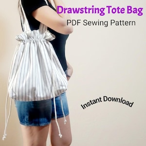May include: A white and black striped drawstring tote bag with long white straps. The bag is gathered at the top and has the text "Drawstring Tote Bag PDF Sewing Pattern" and "Instant Download".