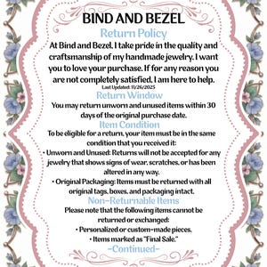 May include: A decorative, ornate frame with a pink and white border, adorned with floral accents in shades of blue and pink. The text within details the return policy for Bind and Bezel handmade jewelry, including return conditions and non-returnable items.