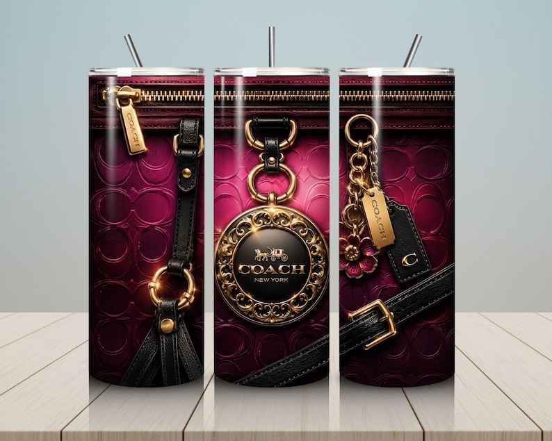 May include: A stainless steel tumbler with a design featuring a close-up of a Coach handbag. The design includes a zipper, gold hardware, black leather straps, and the Coach logo in gold. The background is a deep pink.