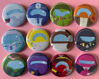 Könnte beinhalten: Ein Set aus zwölf runden Ansteckbuttons mit stilisierten Figuren mit großen Visieren in verschiedenen Farben wie Blau, Grün, Orange, Gelb, Braun, Schwarz, Lila, Rot und Pink, die in einem Raster auf einem hellrosa Hintergrund angeordnet sind.