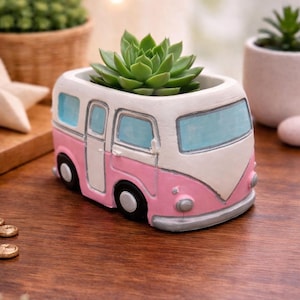 May include: A set of three ceramic mugs with a speckled, matte finish. The mugs are in shades of cream, light gray, and dark gray. Each mug has a simple, minimalist design, perfect for coffee or tea.