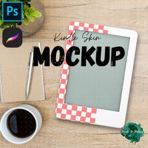 May include: A Kindle skin mockup with a red and white checkered border, set on a wooden surface. The word "MOCKUP" is prominently displayed in large, bold letters. Additional elements include a coffee cup, notepad, pen, and design software icons.