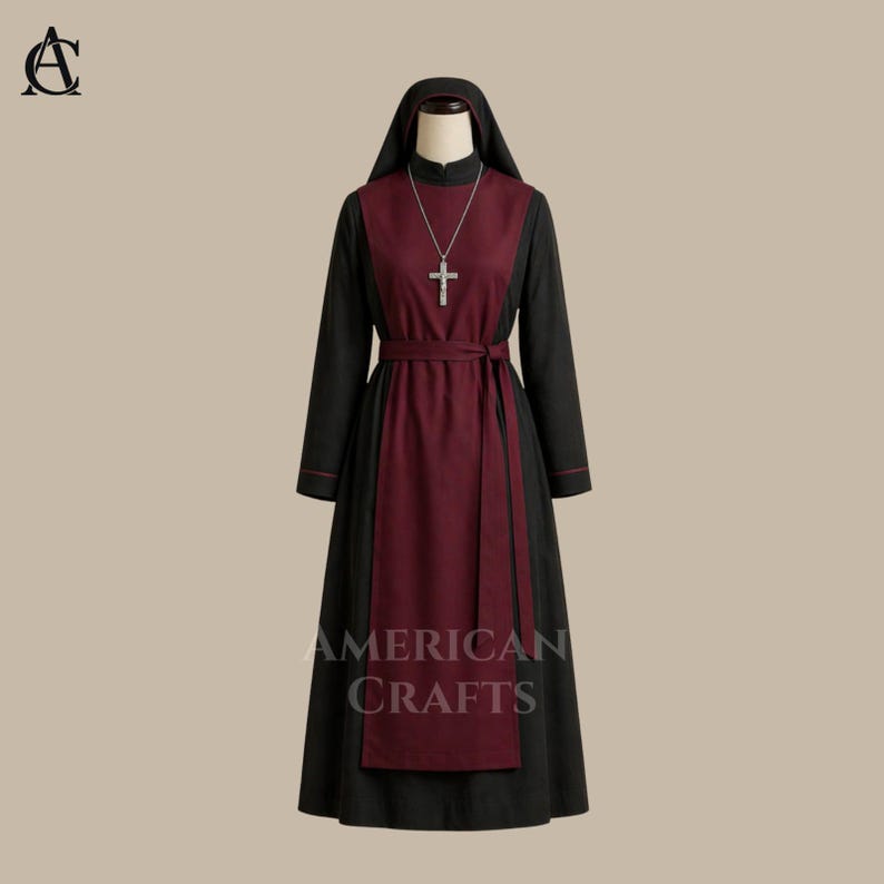 May include: A black and burgundy religious habit with a hood, long sleeves, and a cross pendant. The dress features a burgundy panel down the front and a matching belt. The text "AMERICAN CRAFTS" is printed on the lower part of the dress.