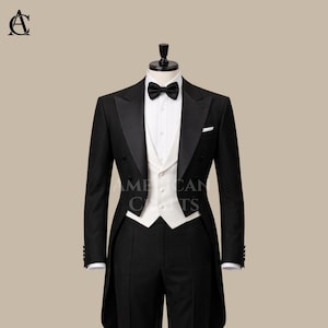 May include: A formal black tuxedo with a white vest, bow tie, and pocket square. The double-breasted jacket has a satin lapel. The suit is displayed on a mannequin. The text "AMERICAN CRAFTS" is visible.