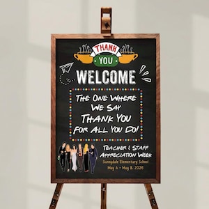 May include: A wooden framed chalkboard sign on a wooden easel. The sign has the words "THANK YOU WELCOME" at the top, with the text "THE ONE WHERE WE SAY THANK YOU FOR ALL YOU DO!" in the center. The bottom of the sign reads "TEACHER & STAFF APPRECIATION WEEK".