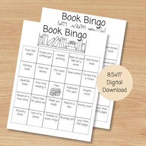 May include: Two white Book Bingo game sheets with black text and illustrations, including a bookshelf graphic. The sheets are labelled "Book Bingo" and feature various prompts related to reading, such as "Fantasy book" and "Over 500 pages."