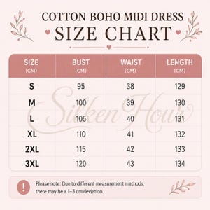May include: A size chart for a cotton boho midi dress with a light pink background. The table lists sizes S through 3XL with corresponding bust, waist, and length measurements in centimeters. It includes a note about a 1-3 cm measurement deviation.