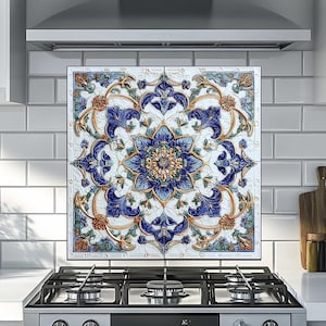 May include: A decorative kitchen backsplash with a floral design. The backsplash features a central blue flower surrounded by blue leaves and orange accents on a white background. It is installed above a gas stove.
