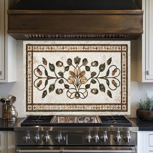 May include: A decorative kitchen backsplash with a floral mosaic design. The mosaic features a central floral motif in shades of brown, green, and beige, framed by a border of small, diamond-shaped tiles. The backsplash is installed above a stainless steel gas range.