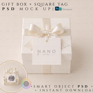 May include: A white gift box with a cream-colored ribbon and bow, and a square tag. The tag has the word "NANO ARCHIVE" printed on it. The image also includes a smaller gift box with a tag.