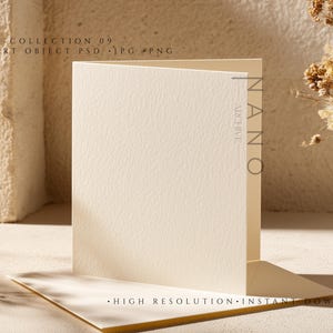 May include: A folded, off-white card with a textured surface, standing upright on a matching base. The card is set against a neutral background with dried floral accents and the text "COLLECTION 09 SMART OBJECT PSD JPG PNG".