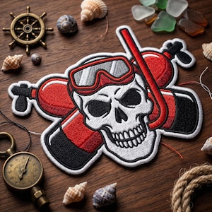 May include: Embroidered patch featuring a skull wearing a diving mask and snorkel, with red scuba tanks behind it. The patch is white, black, and red. The image includes nautical elements like seashells, a ship's wheel, and a compass.
