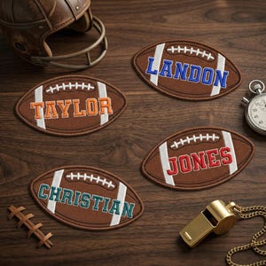 May include: Brown football-shaped patches with names embroidered in orange, blue, red, and green. White stitching details the football design. A vintage football helmet, stopwatch, and whistle are also visible.
