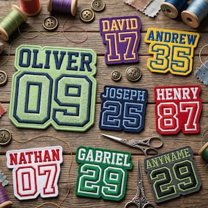 May include: Assortment of embroidered name patches in various colors, including green, blue, red, and purple. Each patch features a name and number, with names like Oliver, David, and Andrew. The patches are arranged on a wooden surface with sewing supplies.