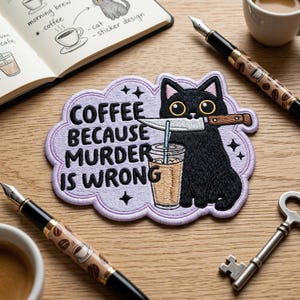 May include: Embroidered patch featuring a black cat holding a knife in its mouth, with a coffee drink and the text "COFFEE BECAUSE MURDER IS WRONG." The patch is surrounded by a light purple cloud shape. Other items include pens and a key.