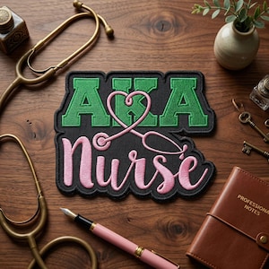 May include: A black patch with the words "AKA Nurse" in green and pink, with a pink stethoscope forming a heart shape. The patch is surrounded by medical tools and a leather notebook.