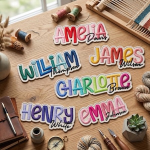 May include: Five embroidered name patches featuring colorful, puffy lettering with cursive surnames. The patches display the names Amelia Davis, William Thompson, James Wilson, Charlotte Brown, Henry White, and Emma Johnson in various vibrant color palettes.