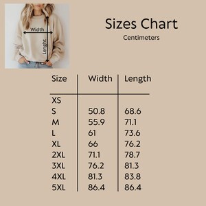 May include: A beige sweatshirt with a size chart in centimeters. The chart lists sizes XS to 5XL, with corresponding width and length measurements. The text "Sizes Chart" is at the top.
