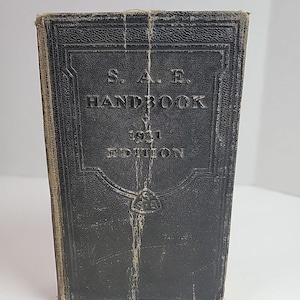 May include: A rustic wooden sign with the text "Welcome to our home" in a handwritten style. The sign features a distressed finish and a simple, inviting design, perfect for entryway decor.