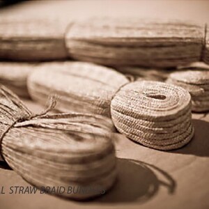 May include: Close-up of four bundles of natural straw braid, a type of natural fiber used for crafting and decorating.