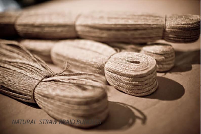 May include: Close-up of four bundles of natural straw braid, a type of natural fiber used for crafting and decorating.