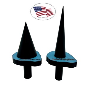 May include: Two black cone-shaped planters with light blue bases and black stems. One planter is labeled "Landon's Seed Planter" and the other "Landon's Cutting Planter". An American flag emblem is in the background, with the text "MADE IN THE USA".